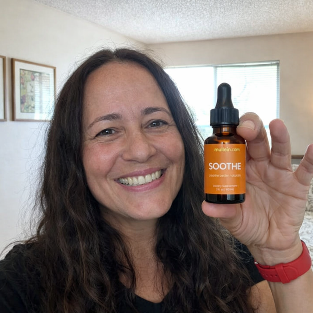 Happy woman holding a bottle of botanical tincture